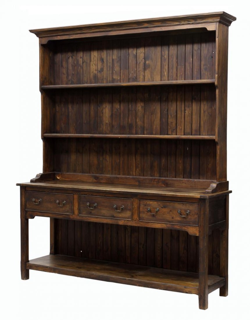 LARGE WELSH STYLE CUPBOARD: Welsh style pine cupboard, late 20th c., a stepped cornice over the display back with plate rack shelves rising on the open center work surface, three frieze drawers, the block legs joined by a lower 
