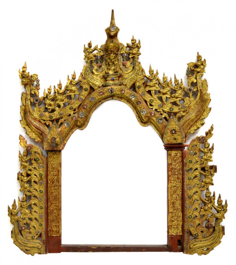 BURMESE GILT & LACQUER CARVED ALTAR FRAME: Burmese gilt and red lacquer wood altar frame, carved figures along the frame with polychrome embellishments, crest having central seated Buddha figure and pointed finial, 31.25"h, 24.25"w, 6lbs Start