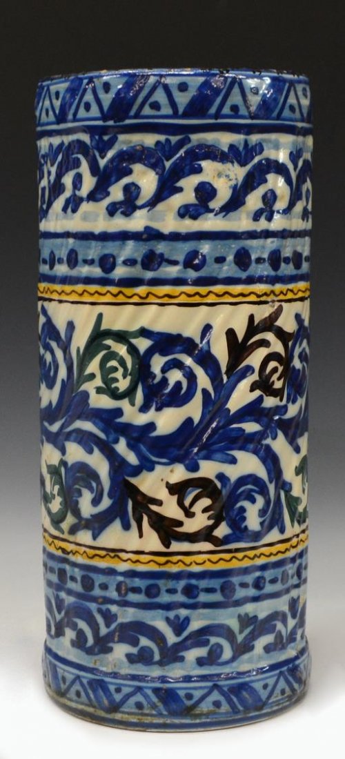 ITALIAN CERAMIC UMBRELLA STAND: Italian polychrome decorated umbrella stand, 20th c., textured body with blue and white foliate motif, 19"h, 8"w, 12.25lbs Start Price: $50.00