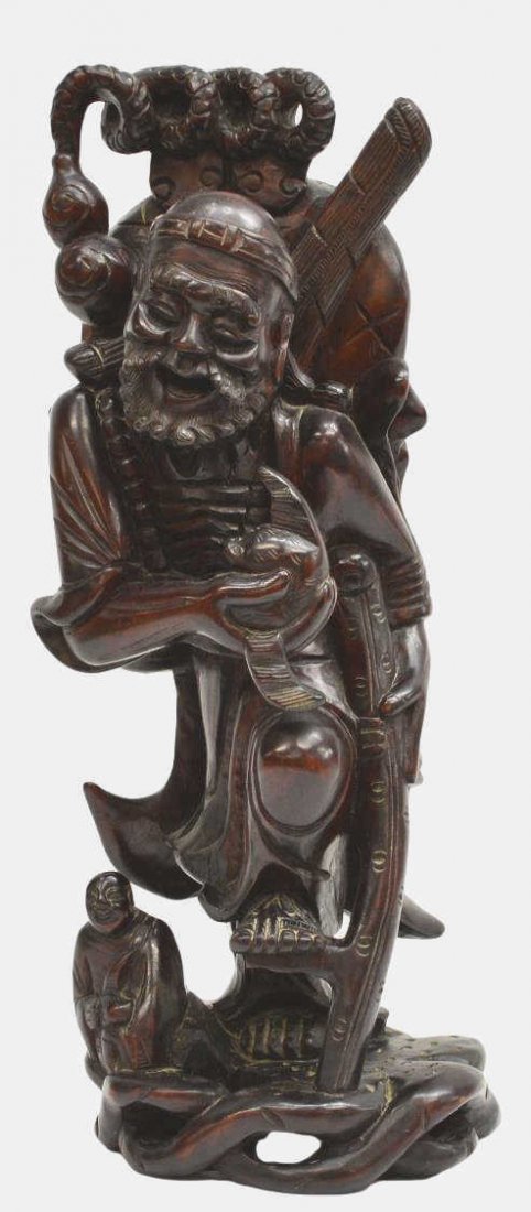 WELL CARVED CHINESE CARVED WOOD FIGURE: Large Chinese carved wood figure with walking stick, ribs showing, holding a wealth ball, intricate design throughout, smaller figure at feet, 18"h, 7"w, 7.25lbs Start Price: $50.00