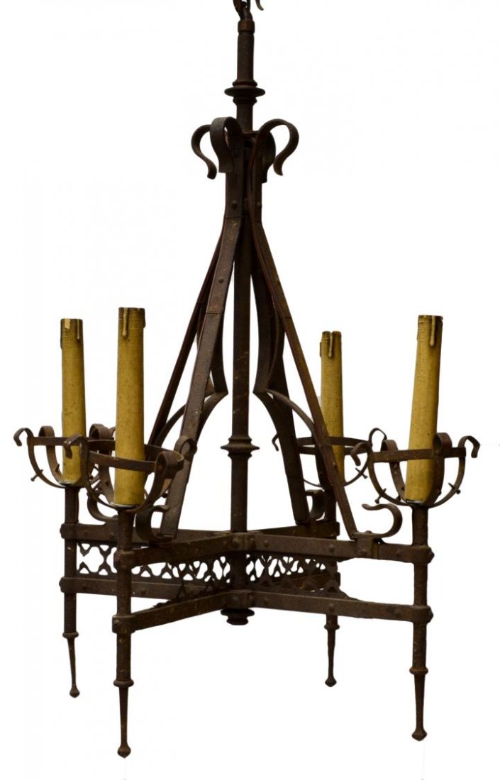 ANTIQUE CONTINENTAL IRON SPIRE CHANDELIER: Gothic style iron four-light candelier, now electrified, a tubular standard issuing four arms having pierced design and arch ornamentation terminating in faux candle light holders, oxidation, loss to 