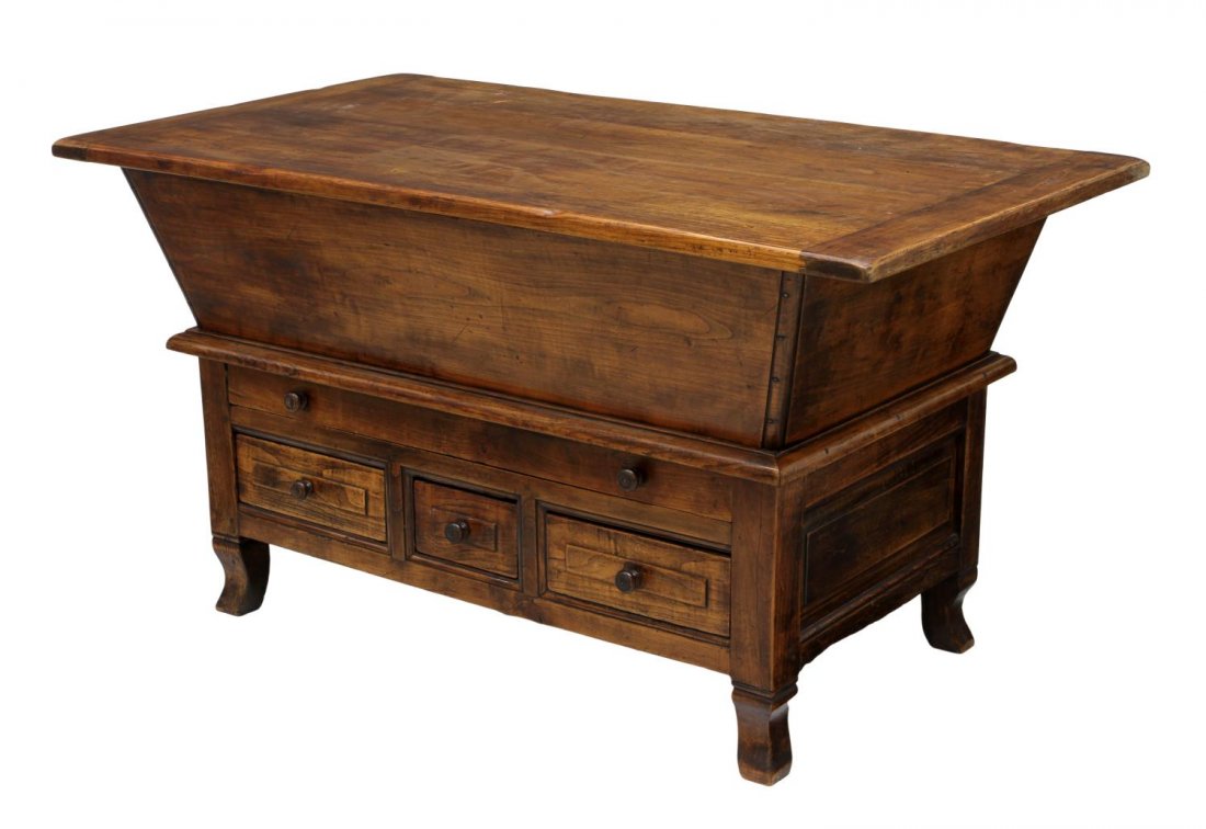 FRENCH PROVINCIAL WALNUT DOUGH TABLE, 19TH C.: French provincial walnut dough table, early 19th c., the rectangular top slides to reveal the canted side interior reinforced with inset hand forged iron corner brackets, a lower long drawer over thre