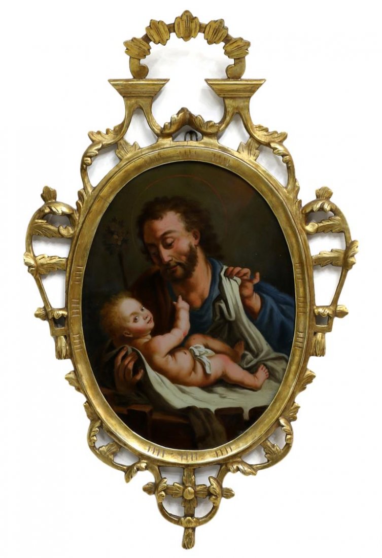 ANTIQUE SPAIN RELIGIOUS REVERSE PAINTING, GILT: Northern Spain religious reverse painting on glass depicting Saint Joseph with the Christ Child, enclosed by an arched, gilded wood and gesso frame carved with open work foliate details, late 19th/ ea