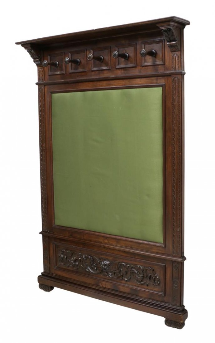 FRENCH RENAISSANCE REVIVAL HALL TREE: French Renaissance Revival hall tree, late 19th c., a protruding cornice over five coat hooks, the central area covered in padded fabric, a lower panel with mask and foliate carving, rising on short v