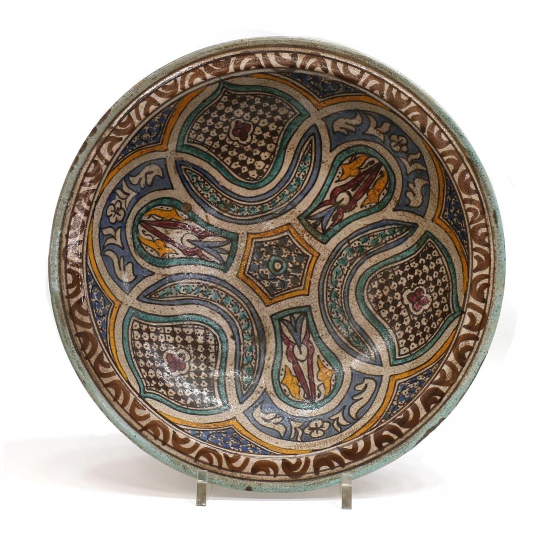 ANTIQUE MOROCCAN GLAZED POLYCHROME CERAMIC BOWL: Antique Moroccan glazed ceramic basin, the circular bowl in a polychrome Arabesque decor, rim wear / loss with age, 3.5"h, 15.25"diam, 5lbs *Provenance: From the estate of Don Yarton (Ohio, Texas, 194