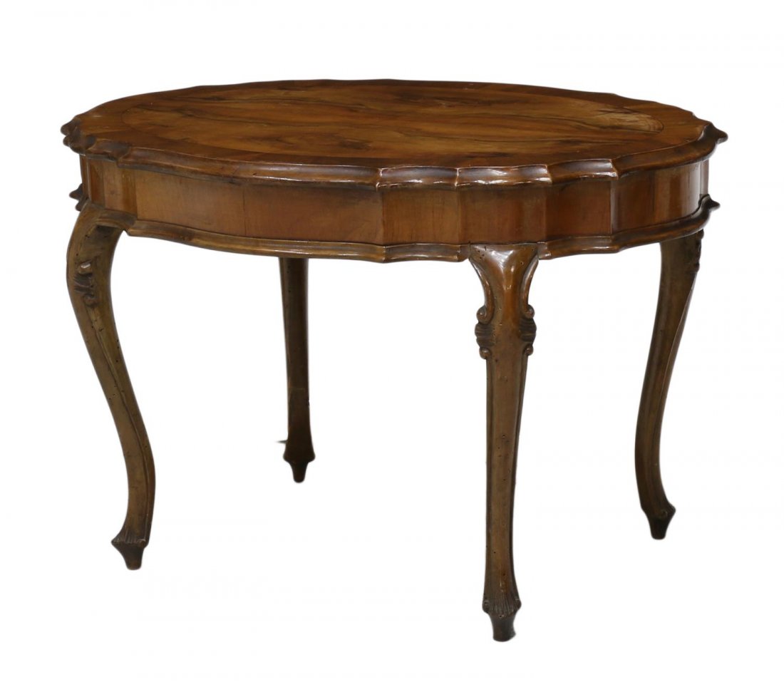 ITALIAN PATCHWORK COFFEE TABLE: Italian patchwork coffee table, 20th c., a shaped oval top rising on cabriole legs with blunt arrow feet, 20"h, 29.5"w, 22.75"d Start Price: $80.00
