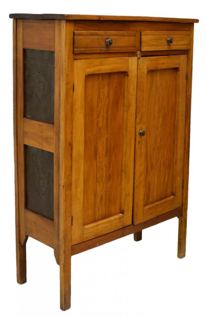 AMERICAN PUNCH TIN PIE SAFE: American country pie safe, c. 1900, having a rectangular top above two drawers, two paneled doors with pressed accents, the sides with punched tin, rising on squared legs, 55"h, 39"w, 16"d Start Price