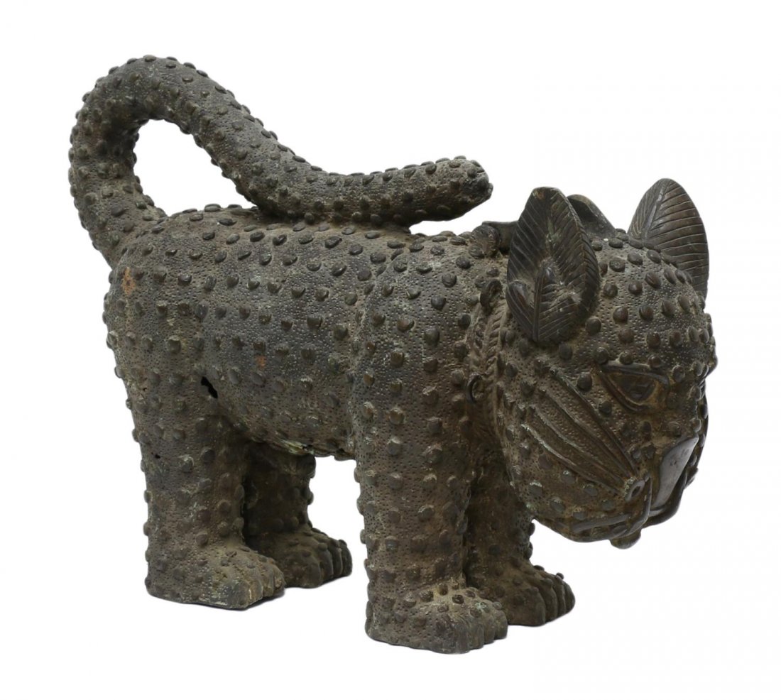 AFRICAN BENIN BRONZE LEOPARD: Bronze aquamanile in the form of a leopard, 19th/20th c., Edo people, Benin, West Africa, raised "spots", a small lid opens to the hollow head for ceremonial use, 11.5"h, 5.25"w. 16.25"l, 19.5lbs Star