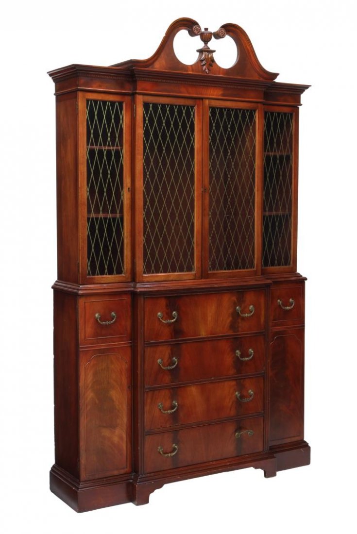 AMERICAN MAHOGANY SECRETARY DISPLAY CABINET: American mahogany breakfront display secretary cabinet, c. 1950, a split pediment cornice with finial over four glass doors with gilt faux astragal decoration, a central pull out drop front secretary 