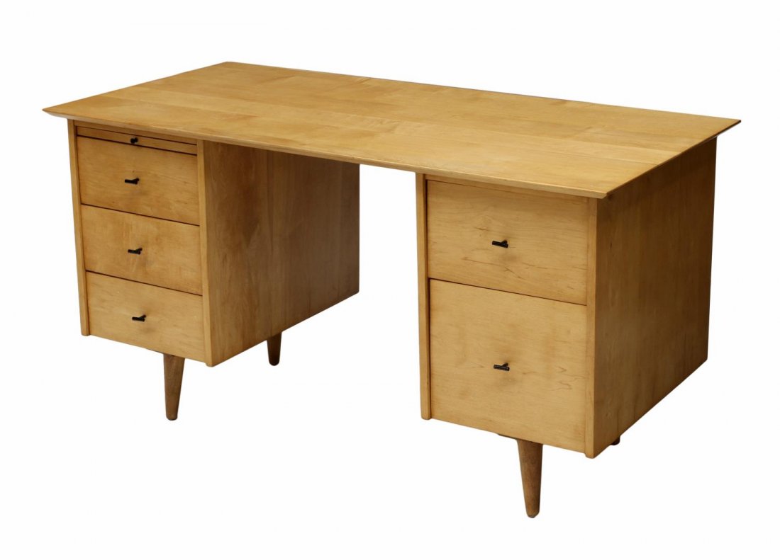 MID-CENTURY MODERN PAUL MCCOBB PLANNER GROUP DESK: Paul McCobb (Massachusetts, 1917-1969) Planner Group birch finish desk for Winchendon Furniture Company, 1950's, a rectangular top over five drawers with pull out writing surface, all rising on tapere