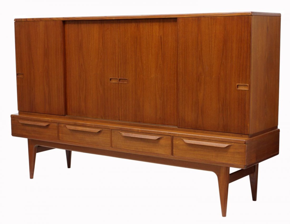 DANISH TEAKWOOD MID-CENTURY MODERN SIDEBOARD: Danish mid-century modern teakwood sideboard, 1950's, the upper cabinet with four sliding doors opening to shelves, mirror and three drawers, the lower cabinet with four drawers, rising on tapered leg