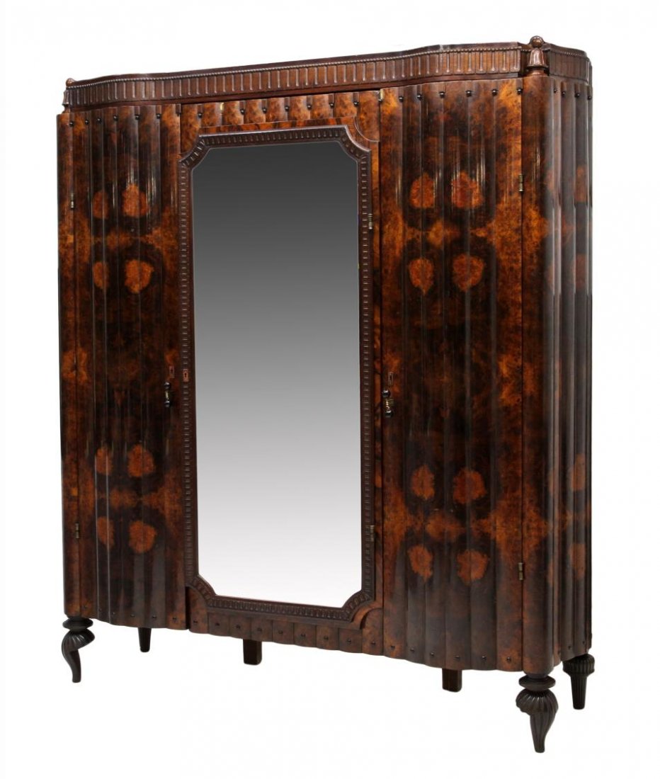 ITALIAN ROSEWOOD ARMOIRE ARREDAMENTO BORSANI: Italian rosewood armoire, c. 1930, design by Osvaldo Borsani (Swiss/Italian, 1911-1985) for Arredamento Borsani, central mirrored door front flanked by two serpentine doors, all opening to shelved sto