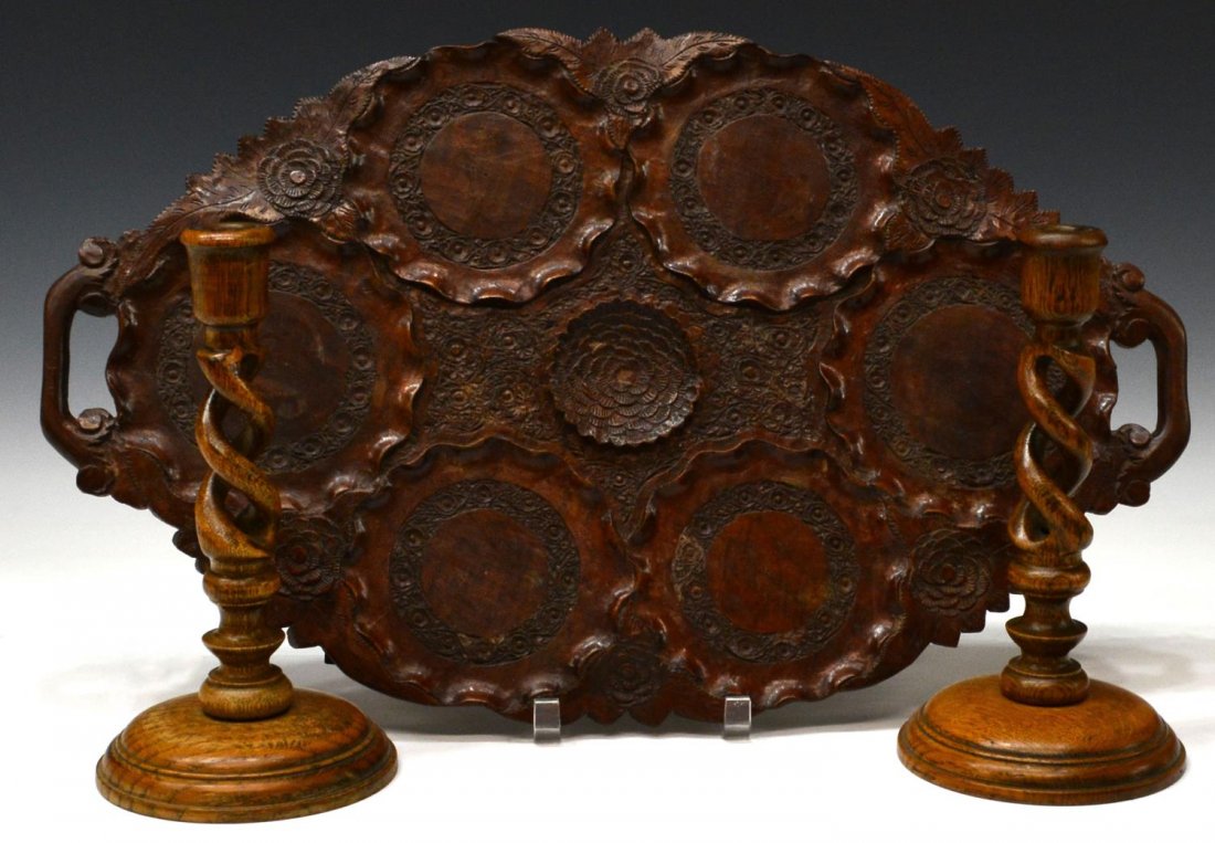 (3) ENGLISH BARLEY TWIST CANDLETICKS & A WOOD TRAY: (lot of 3) Carved wood items, including: (1) highly carved mahogany tray, oval form with handles decorated with circular sections having raised flowers and foliate, 22.5"l, 14"w; (pair) English oak ba
