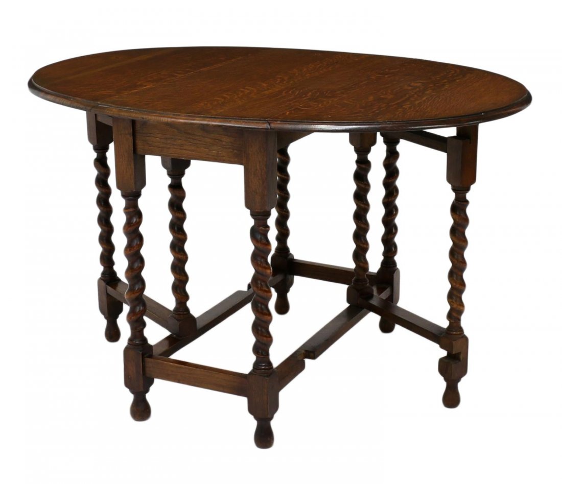 ENGLISH OAK OVAL DROP LEAF BARLEY TWIST TABLE: English oak drop side table, oval leaves rise on spiral twist legs, joined by stretches, on elongated bulb feet, extended: approx 47"l, 36"d Start Price: $150.00