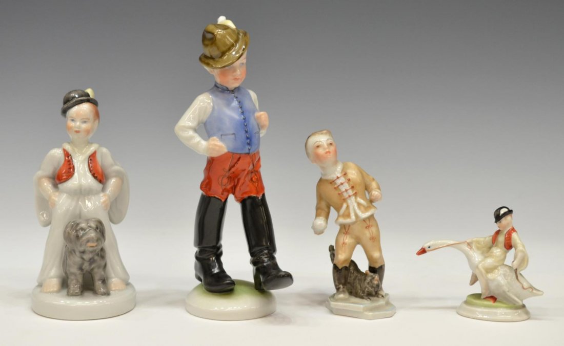 (4) COLLECTION HEREND PORCELAIN FIGURES: (lot of 4) Collection of Hungarian porcelain figures, Herend, including: (1) boy with Puli dog, 6.75"h; (1) traditionally dressed boy in big black boots, 8.5"h; (1) boy on goose, 3.25"h; (1) boy throw