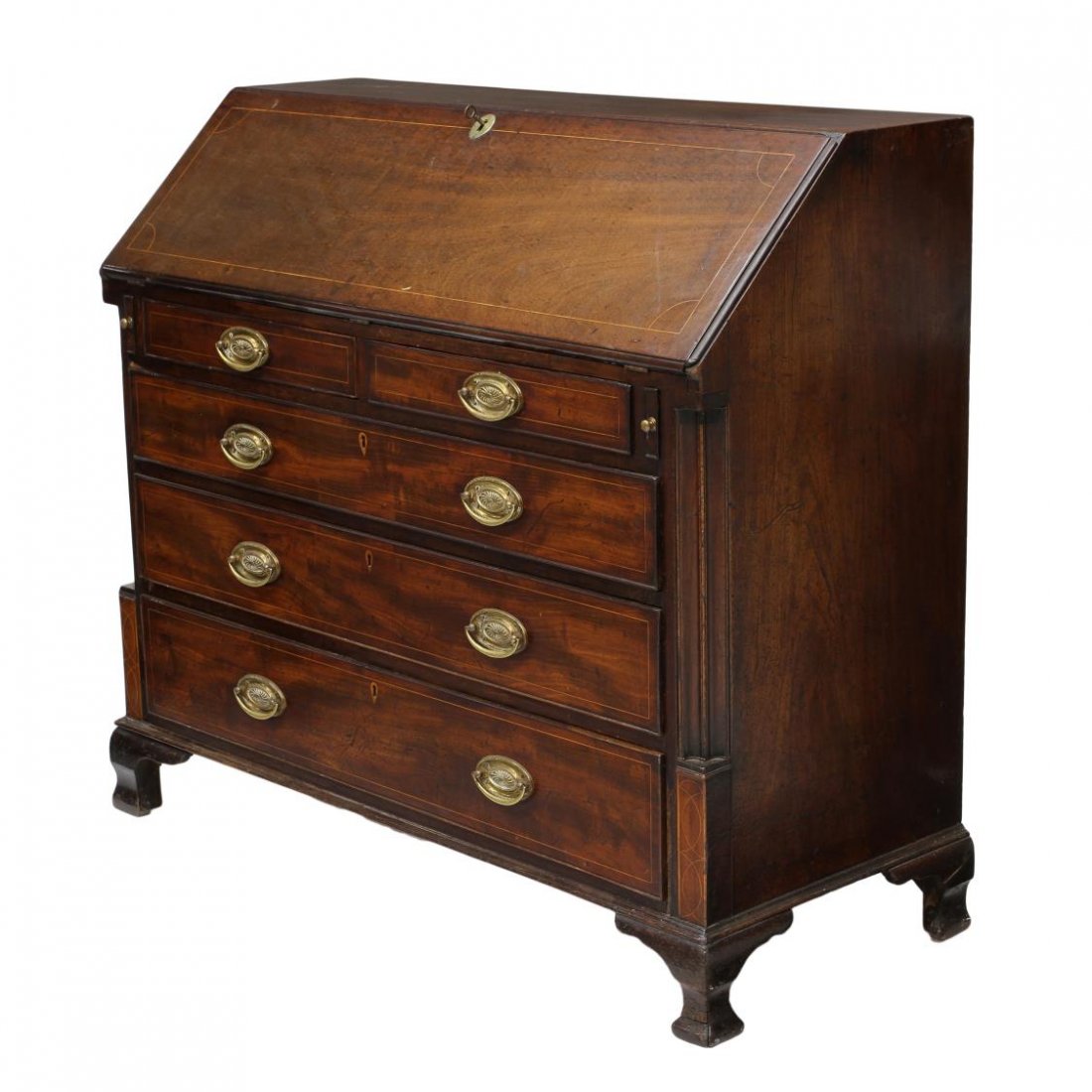 ANTIQUE GEORGIAN MAHOGANY BUREAU: British Georgian mahogany bureau, c. 1800, accented with string inlay, the hinged slant front opens to a fitted gallery with drawers, hidden drawers, slots, at the front two short drawers over three l