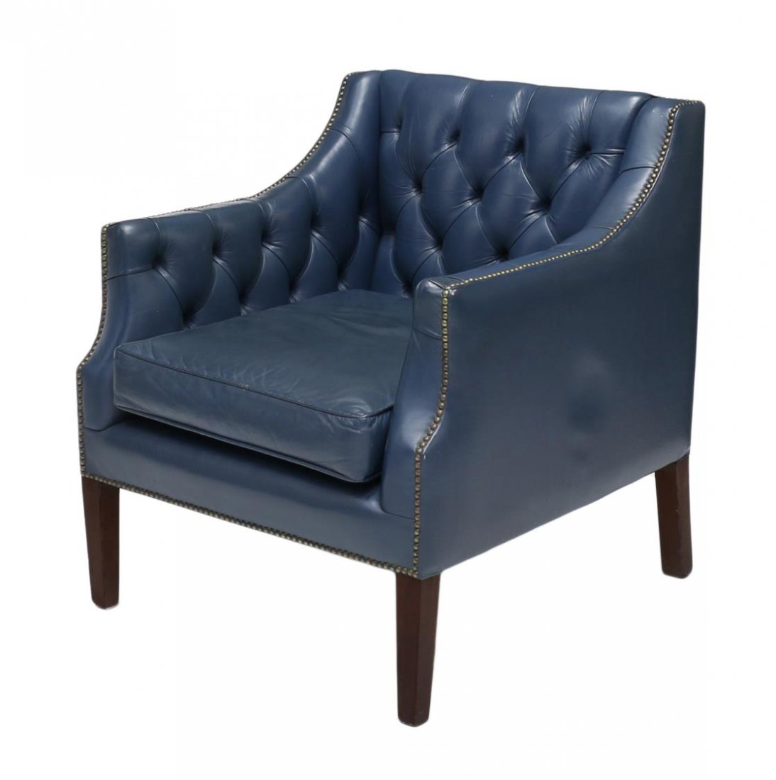 CHESTERFIELD TUFTED BLUE LEATHER CLUB CHAIR: Chesterfield style tufted blue leather club chair, each accented with brass tacks and raised on wood legs, approx 33"h, 27.75"w, 29"d *matching sofa to be offered in this auction Start Price: $150.00