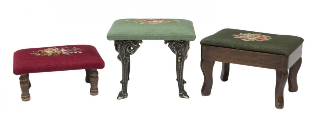 (3) NEEDLEPOINT FOOTSTOOLS: (lot of 3) Footstools with floral needlepoint tops, two with green ground, one with red, one on cast iron cabriole legs, the other on shaped wood legs, largest: 11.5"h, 14"w, 10.5"d Start Price: $50.0
