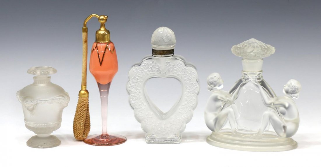LALIQUE, DEVILBISS & FEMALE NUDE PERFUME BOTTLES: (lot of 4) Collection vintage perfume / scent bottles: (1) Lalique for Guerlain Bouquet de Faunes scent bottle, c. 1925, with stopper, marked Guerlain Paris on side, chip to foot as pictured, 4"h; (1)
