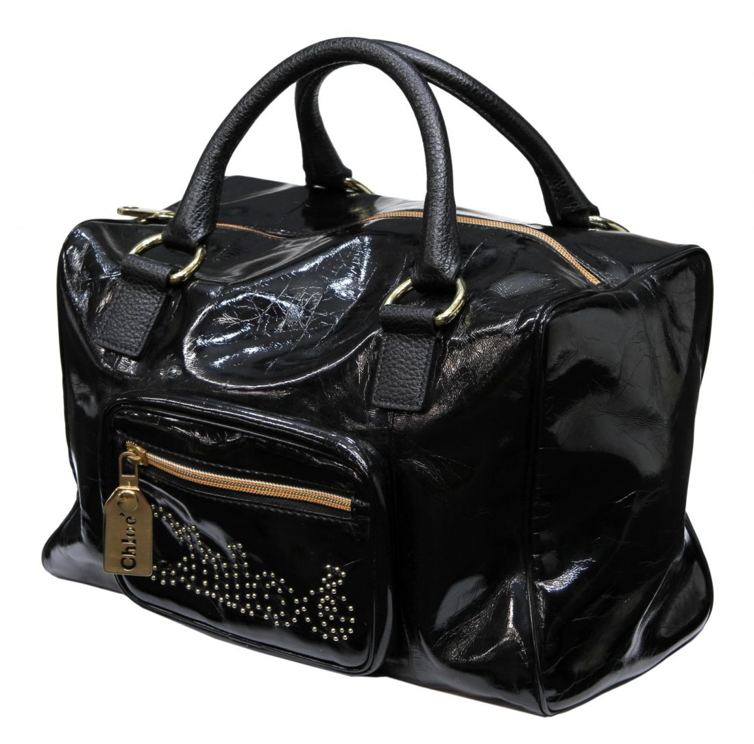 CHLOE BLACK PATENT LEATHER & GILT METAL HANDBAG: Chloe black patent leather bag, gilt metal hardware and beaded logo outline, green canvas interior with zip pocket, accompanied by large worn dust bag, bag: approx 8"h, 12.5"l, 6"w, 1lb Start Price: $