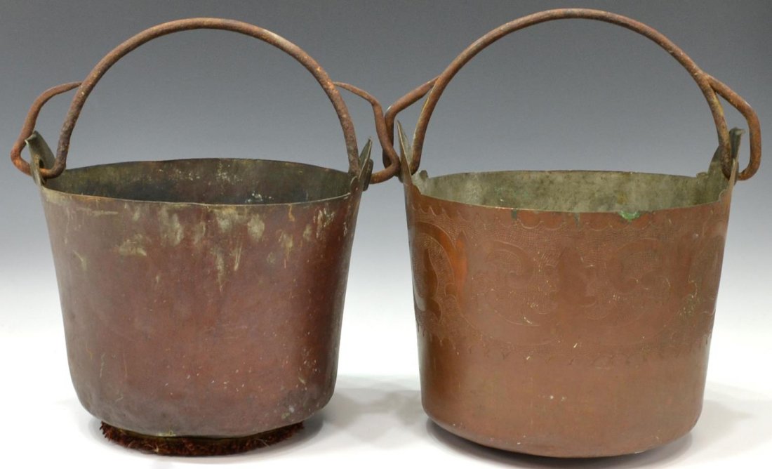 (2) CONTINETAL COPPER HANDLED PAILS / BUCKETS: (lot of 2) Continental copper buckets, single iron handle, one with incised scroll band, patination, largest: 11"h, 11.5"diam, 9.75lbs total Start Price: $100.00