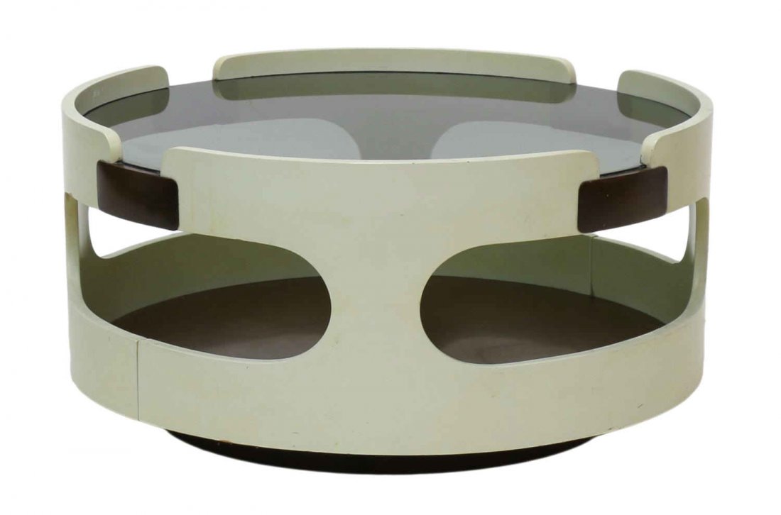 ITALIAN MODERN CIRCULAR COFFEE TABLE: Italian modern smoked glass top coffee table,c.. 1970, the circular frame in white with oval cutouts around the dark glass top over the lower wood base, 13.75"h, 28.25"diameter Start Price: $150.00