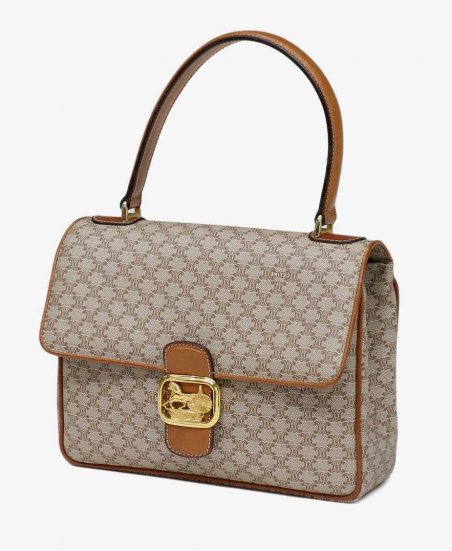 CELINE BEIGE MONOGRAM CANVAS HANDBAG / PURSE: Celine beige monogram canvas handbag, interior having two pockets and one zippered cell, brown leather trim, gold hardware, approx 8"h, 9.5"l, 2.5"d, 1lbs Start Price: $60.00