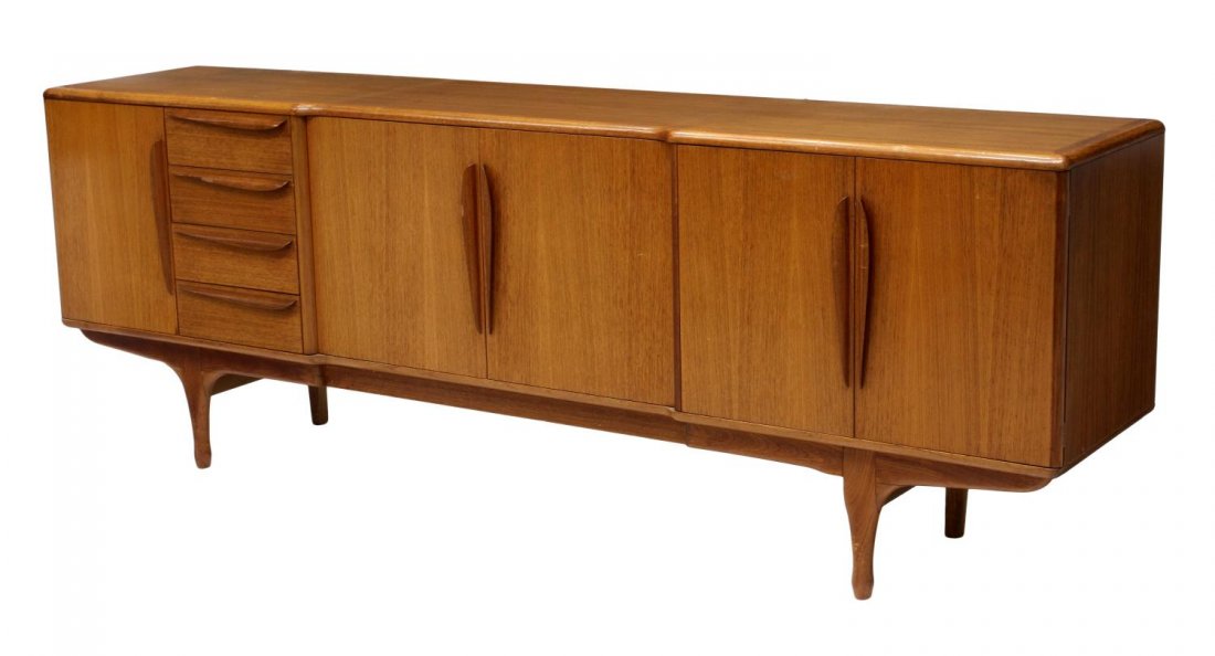 ITALIAN MID-CENTURY MODERN TEAKWOOD SIDEBOARD: Italian mid-century modern teakwood sideboard, c. 1960, rectangular with five doors and four drawers, rising on turned tapered legs, 33"h, 94.5"w, 19"d Start Price: $400.00