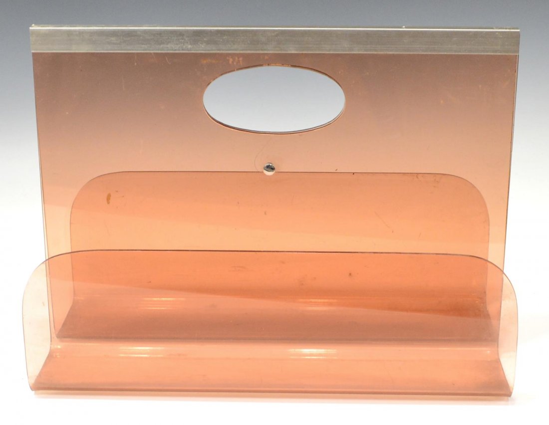 ITALIAN MODERN DESIGN PLEXIGLASS MAGAZINE RACK: Italian modern plexiglass magazine holder, c. 1970's, symmetrical molded pink plexi design, with oval handle and silver toned metal accents, some scuffs,approx, 11.25"h, 8"w, 15.5"d, 4.25lbs total Sta