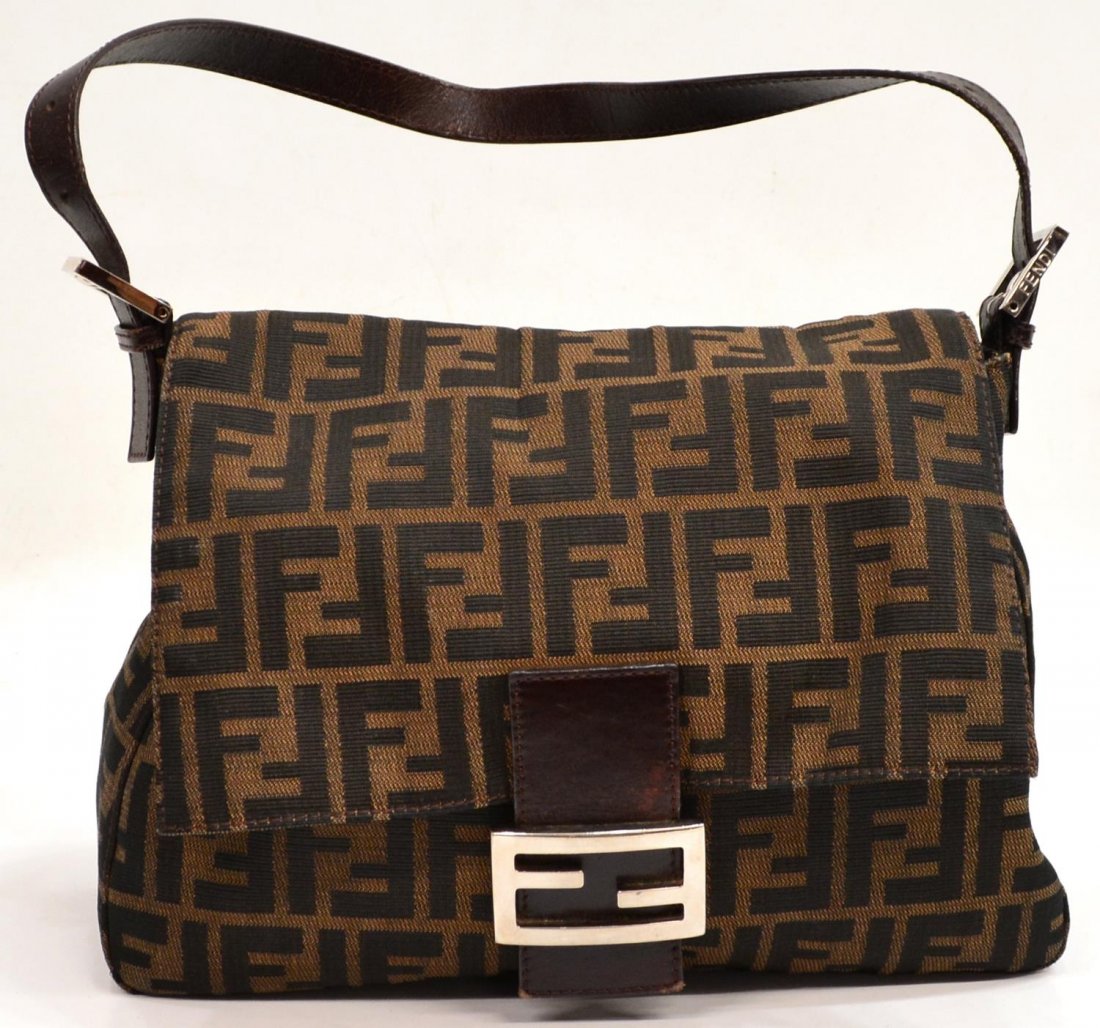 FENDI MONOGRAM CANVAS & LEATHER SHOULDER BAG: Fendi monogram canvas shoulder bag, dark brown leather trim and strap, silver tone metal logo closure on the fold over flap, lined interior with single zip pocket, bag: approx 8.5"h, 11"w, .25lb Start
