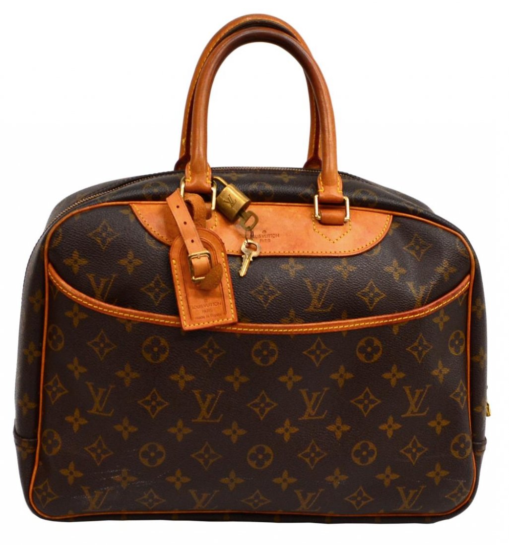LOUIS VUITTON DEAUVILLE MONOGRAM CANVAS HANDBAG: Louis Vuitton Deauville handbag in monogram canvas, leather handles and trim, luggage tag, lock and key, open exterior pocket, (4) interior pockets, (4) elastic holders, some patination, staining, sur