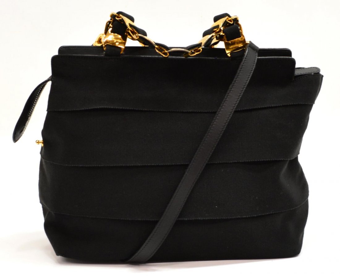 SALVATORE FERRAGAMO BLACK CANVAS HANDBAG: Salvatore Ferragamo handbag in black canvas with gold tone hardware, double handle straps of gold tone chain links, black fabric interior with one zipper side pocket, zipper closure, accompanied by de