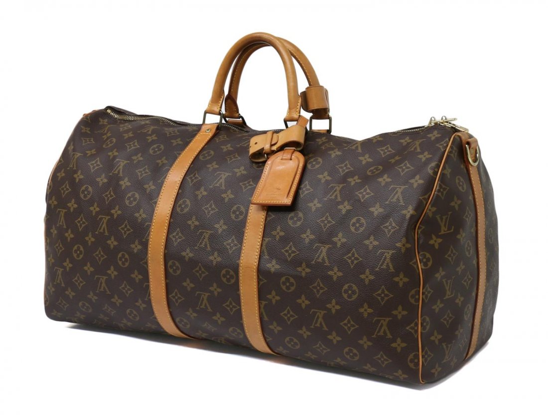 LOUIS VUITTON KEEPALL 60 MONOGRAM CANVAS DUFFLE: Louis Vuitton monogram canvas 'Keepall 60' travel duffle bag, honeyed leather handles and trim, luggage tag, retaining lock and keys, some surface stains and wear to handles and trim, 13.5"h, 24"w, 11