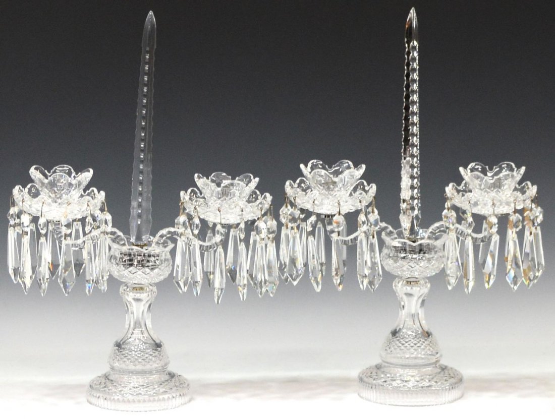 (2) WATERFORD CUT CRYSTAL & PRISM CANDELABRA: (pair) Waterford crystal two- light candelabra, central chalice shaped body issuing two curved arms holding bobeches terminating in candle holders, hung with crystal prisms, standard holding single ob