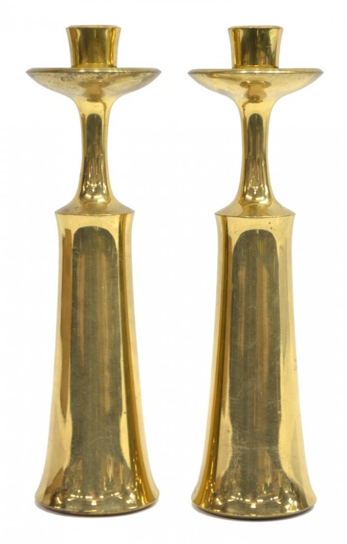 (2) DANISH MID-CENTURY MODERN BRASS CANDLESTICKS: (pair) Danish brass candle holders, c. 1956, design by Jens Harald Quistgaard (Danish, 1919-2008) for Dansk Designs, Copenhagen, Denmark, hollow interior base marked Dansk Designs, Danmark, JHQ, wear