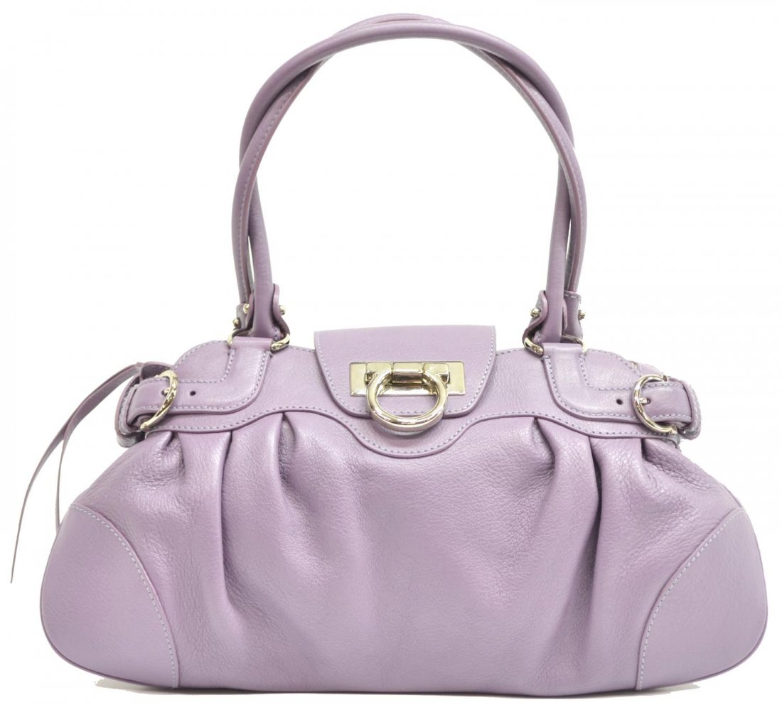 SALVATORE FERRAGAMO PURPLE GRAINED LEATHER HANDBAG: Salvatore Ferragamo handbag in soft purple grained leather with silver tone hardware, light purple fabric interior with one side zipper pocket, zipper closure with leather flap, bag: approx 8"h, 14"w,