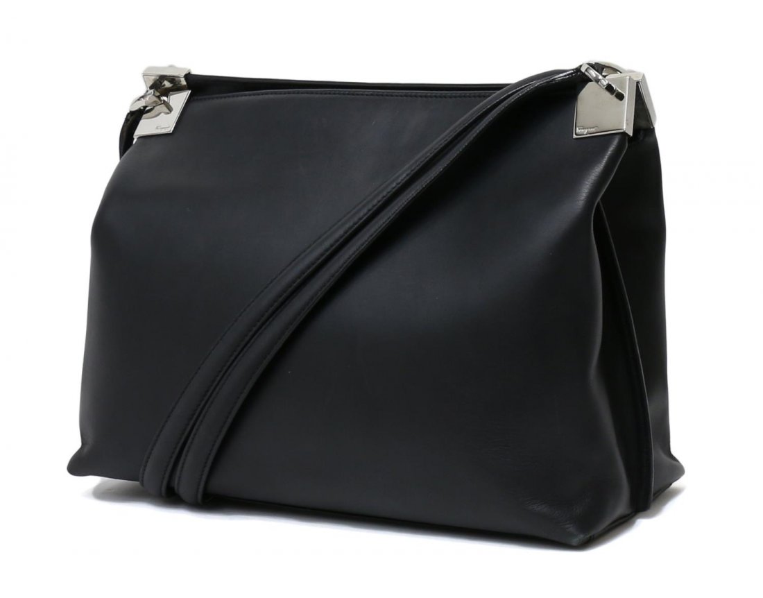 SALVATORE FERRAGAMO BLACK LEATHER SHOULDER BAG: Salvatore Ferragamo shoulder bag in black leather with silver tone hardware, double straps, black fabric interior with three pockets, one zipper center pocket, one side zipper pocket, surface wear to