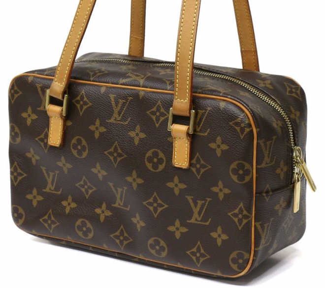 LOUIS VUITTON CITE MM MONOGRAM CANVAS SHOULDER BAG: Louis Vuitton "Cite MM' monogram canvas handbag, exterior zippered pocket, brown leather interior, three slot pockets, bag: approx. 6.25"h, 11"w, 4.5"d, 1.25lbs Start Price: $300.00