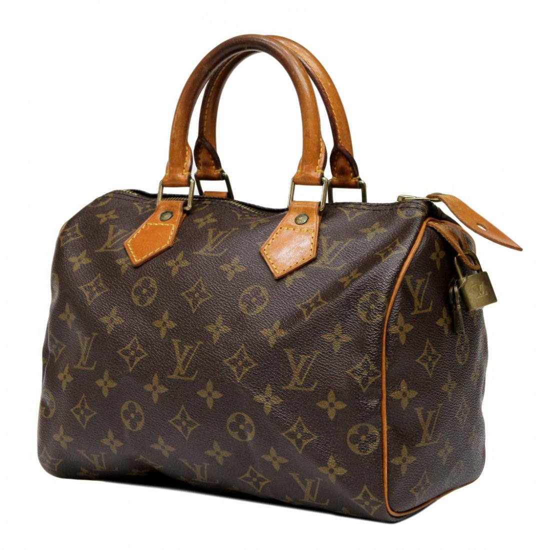 LOUIS VUITTON MONOGRAM CANVAS SPEEDY 25 HANDBAG: Description Louis Vuitton 'Speedy' 25 in monogram canvas with lock and keys, patination / wear to handles and leather piping, trim, canvas interior with slot pocket, bag: approx 8"h, 9.5"l, 6"w, 1lb S