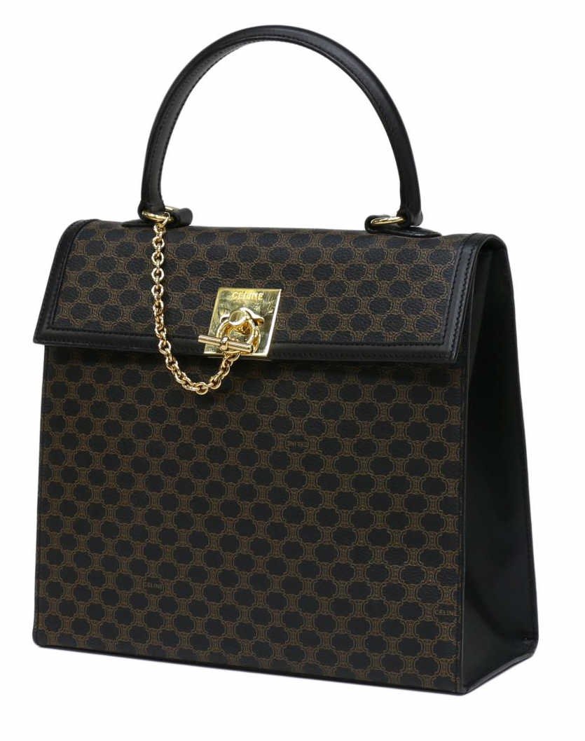 CELINE MONOGRAM CANVAS & GILT METAL HANDBAG: Celine monogram canvas "Kelly" handbag, the black coated canvas ground with brown monogram decor, black leather handle, gilt metal hardware, slot and zipper pocket to interior, bag only: 10.25"h, 10.7