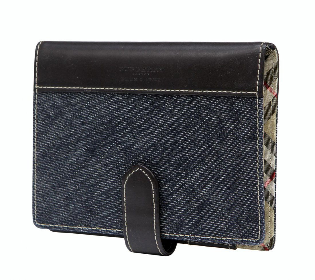 BURBERRY BLUE LABEL LONDON DENIM LEATHER AGENDA: Burberry Blue Label London agenda / day planner in denim and brown leather with interior slots, zip pocket and identification window, retaining original papers, 5.75"h, 4.5"w, .25lb Start Price: $60.0