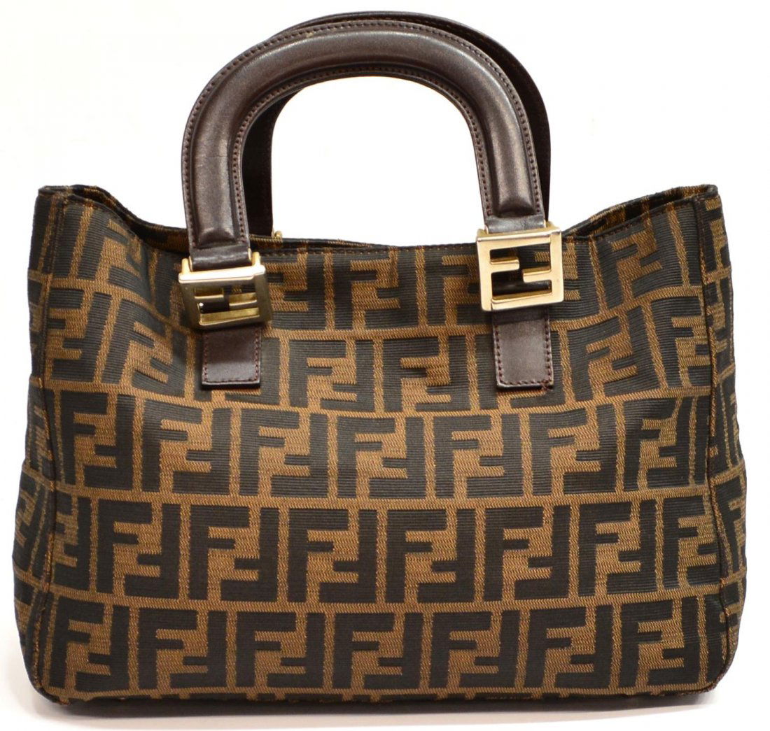 FENDI BROWN MONOGRAM CANVAS SHOULDER BAG / TOTE: Fendi brown monogram canvas tote bag, snap closure, brown leather loop handles, interior liner with some wear, single zipped pocket, the whole set on small silver tone metal feet, bag: approx 8.5"h, 1