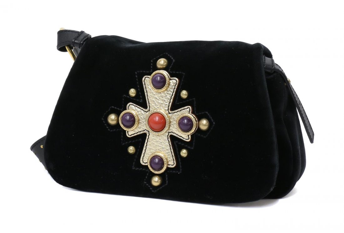 YVES SAINT-LAURENT BLACK VELVET CABOCHON HANDBAG: Yves Saint-Laurent black velvet bag with decorated flap, cabochons and gilt leather, leather shoulder strap accented with gilt metal dots, lined interior with single slot pocket, bag: approx 6.5"h, 9.