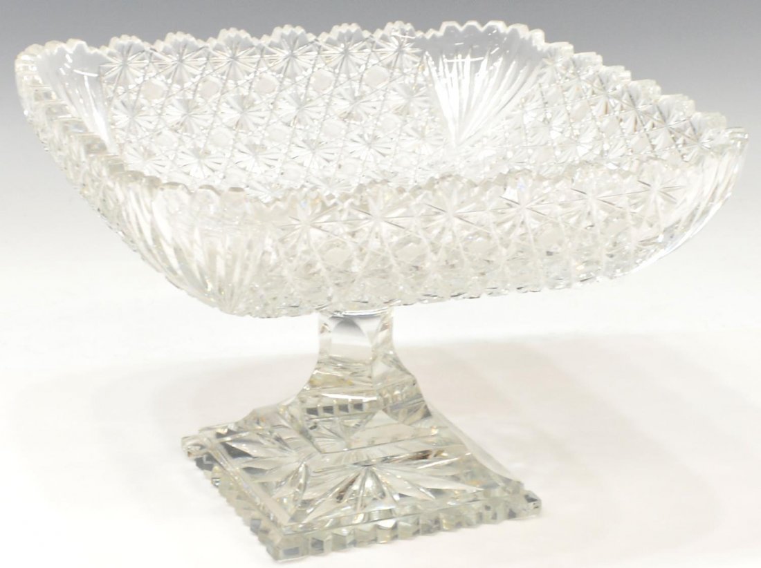 AMERICAN BRILLIANT PERIOD RUSSIAN CUT COMPOTE: Large American 'Russian' Brilliant cut glass compote with fan cut corners, paneled stem on a stepped cut foot, approx 6.75"h, 10.25"sq, 8.25lbs Start Price: $200.00
