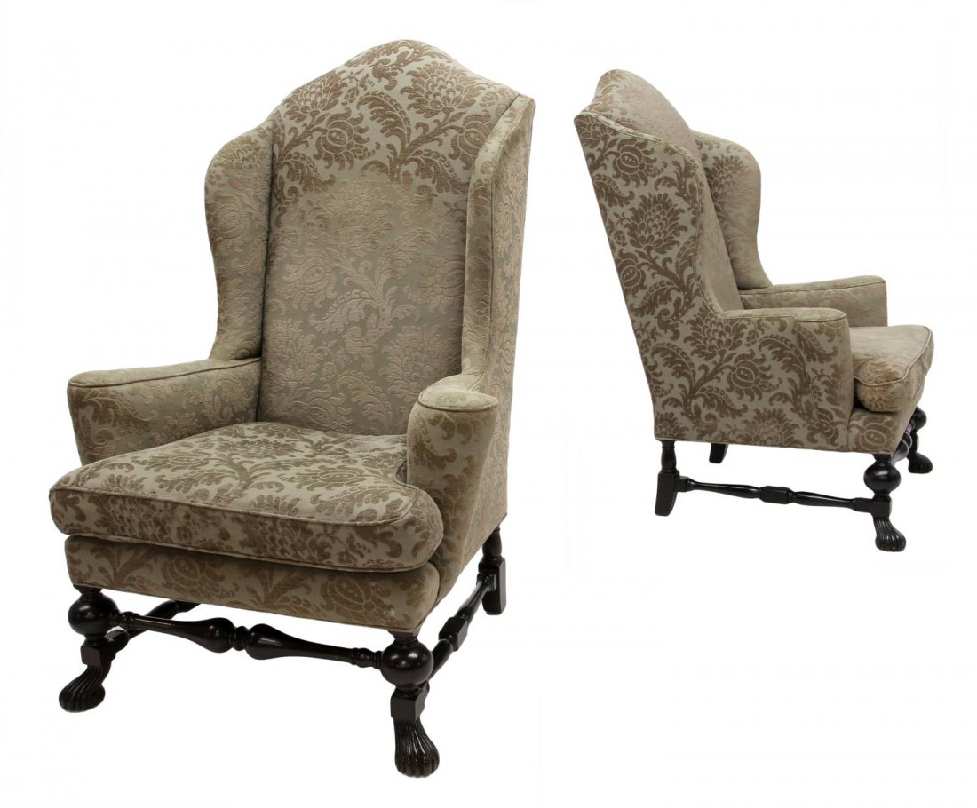(2) OVERSIZE BAKER WING BACK ARM CHAIRS: (lot of 2) Oversize wingback arm chairs, Baker Furniture Company, upholstered in foliate brocaded fabric, the arched back with shaped sides, out scrolled arms flanking the removable feather/down cushi
