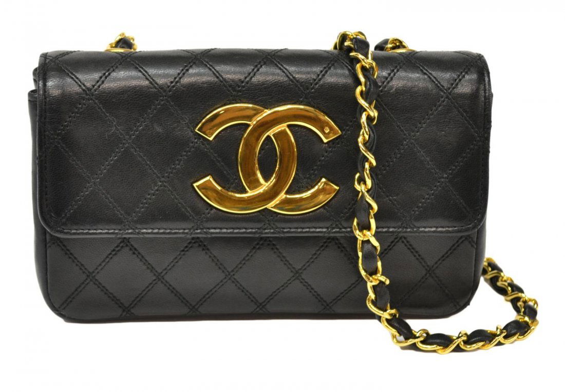 VINTAGE CHANEL MINI DIAMOND STITCH SHOULDER BAG: Vintage Chanel mini shoulder bag, c. 1995, in black quilted lambskin, diamond stitch, gilt CC logo, gold tone chain strap with leather, retaining original box with tears wear, bag: approx 5"h, 7.75"w,