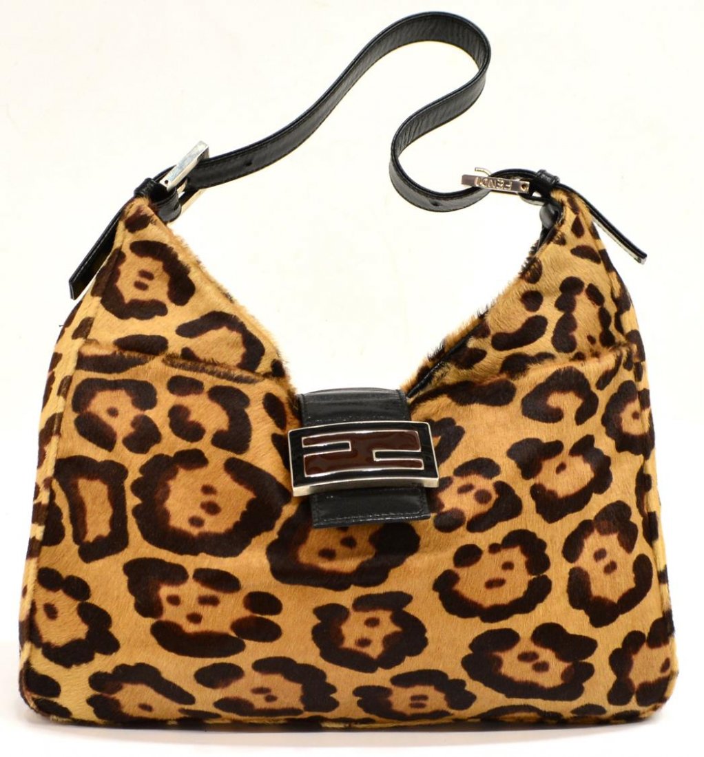 FENDI CHEETAH PRINT PONY HAIR SHOUDLER BAG: Fendi pony hair handbag in a cheetah print motif, two exterior slots on with interior zipped pocket, black leather strap and snap closure, with silver tone metal hardware, color variation at bottom, l