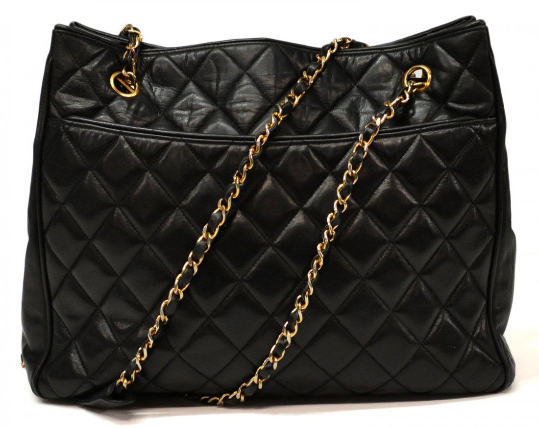 CHANEL BLACK QUILTED LEATHER & GILT METAL PURSE: Chanel black quilted leather shoulder bag, having gold tone hardware and gilt chain strap interlaced with leather, the exterior with slot pockets, two zipped pockets to the interior, one lacking zippe