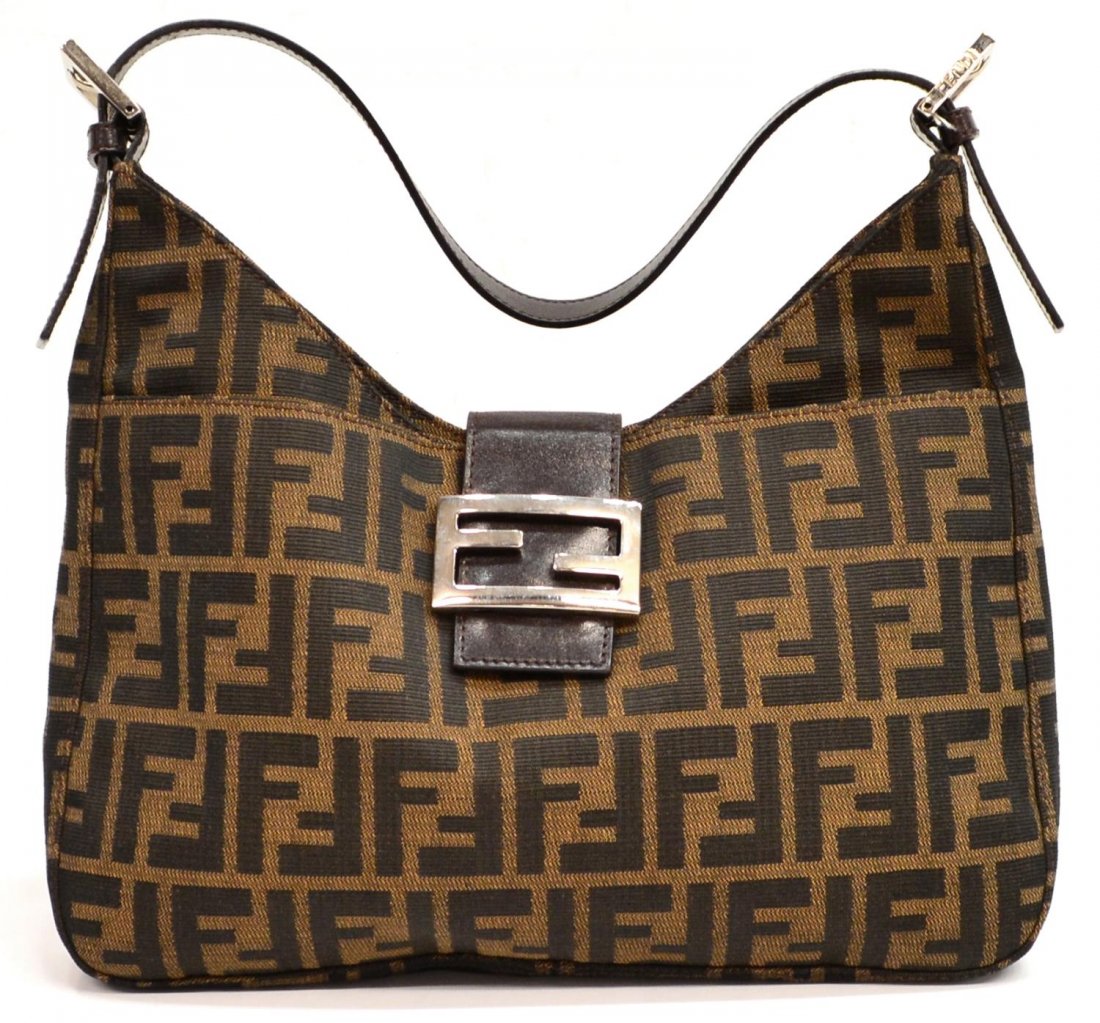 FENDI MONOGRAM CANVAS & LEATHER HANDBAG: Fendi monogram canvas handbag having dark brown leather strap and silver tone metal hardware, exterior slot pocket, lined interior with single zip pocket, bag: approx 7"h, 12"w, .25lb Start Price: $80