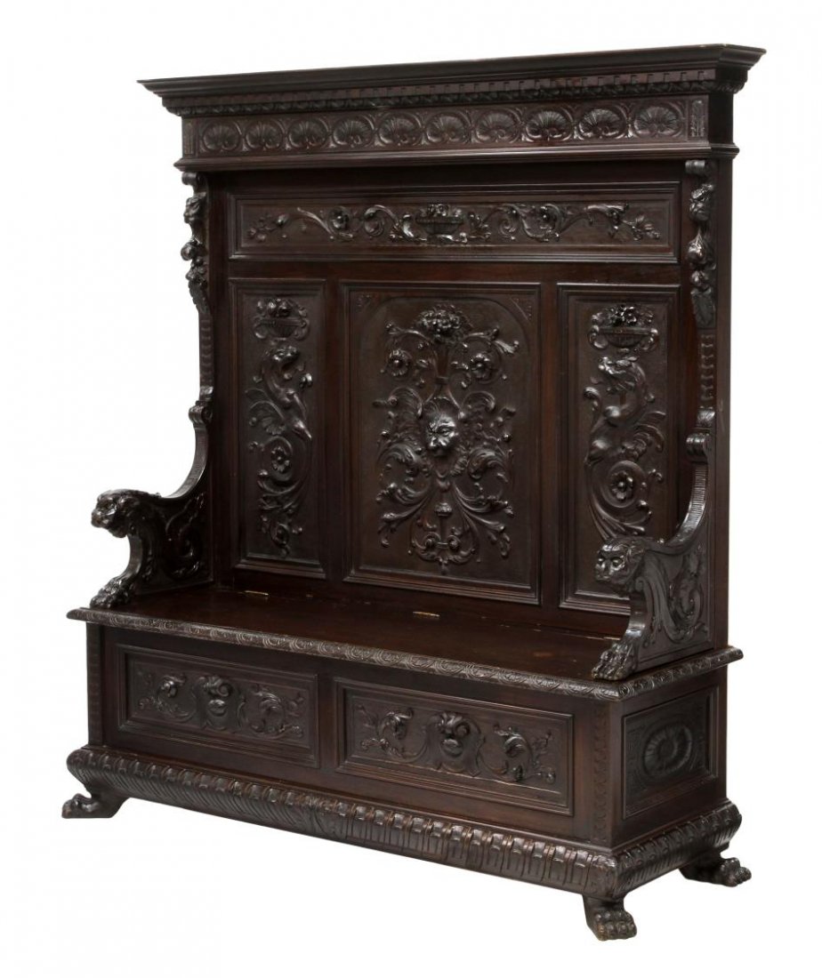 ITALIAN RENAISSANCE REVIVAL CARVED HALL BENCH: Italian Renaissance Revival hall bench, late 19th c., the high back with protruding cornice, dentil molding, a shell carved frieze, the back with mask, griffin and foliate carved panels, seated griffi